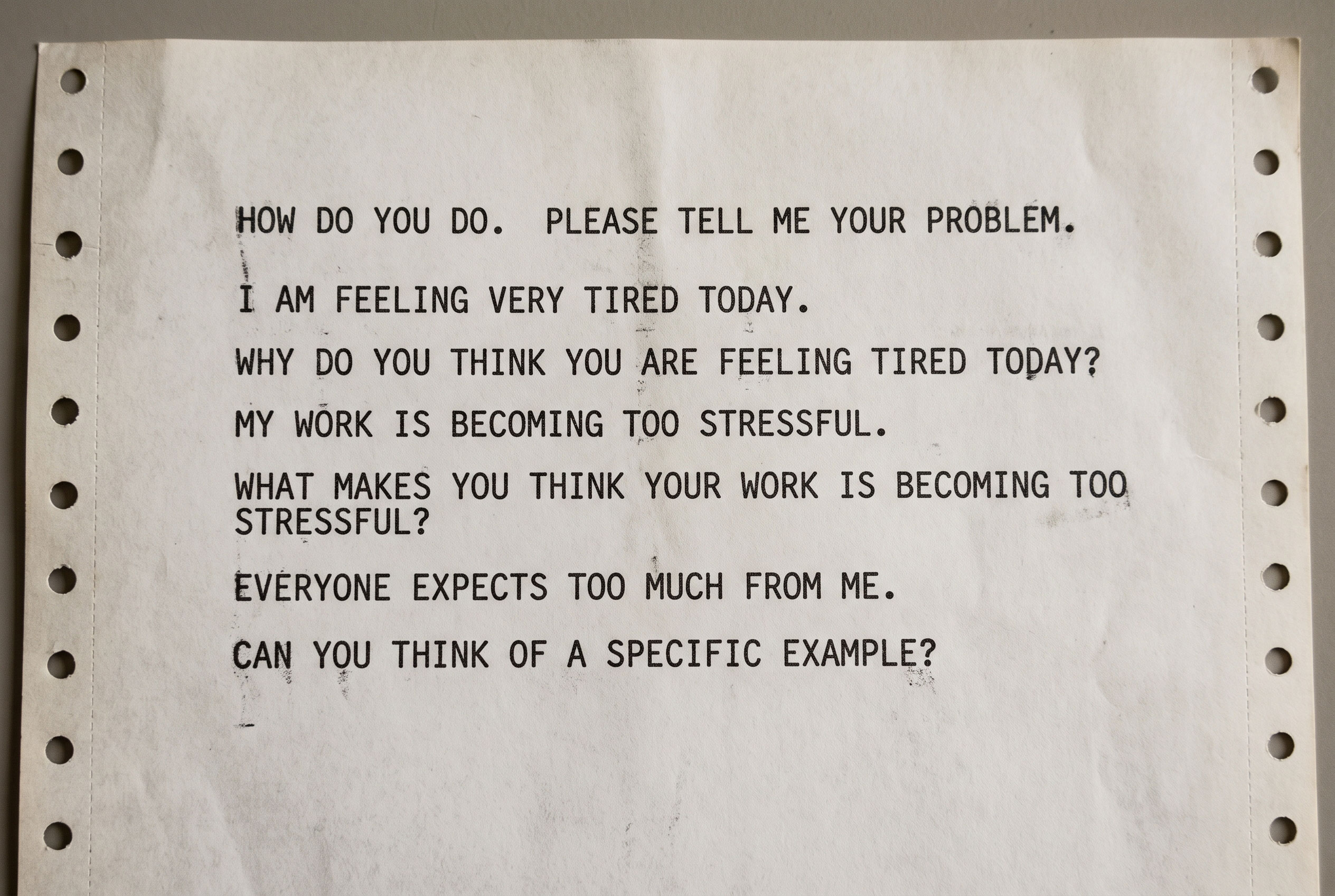 A monochrome printout of a short text conversation between a user and an early chatbot.
