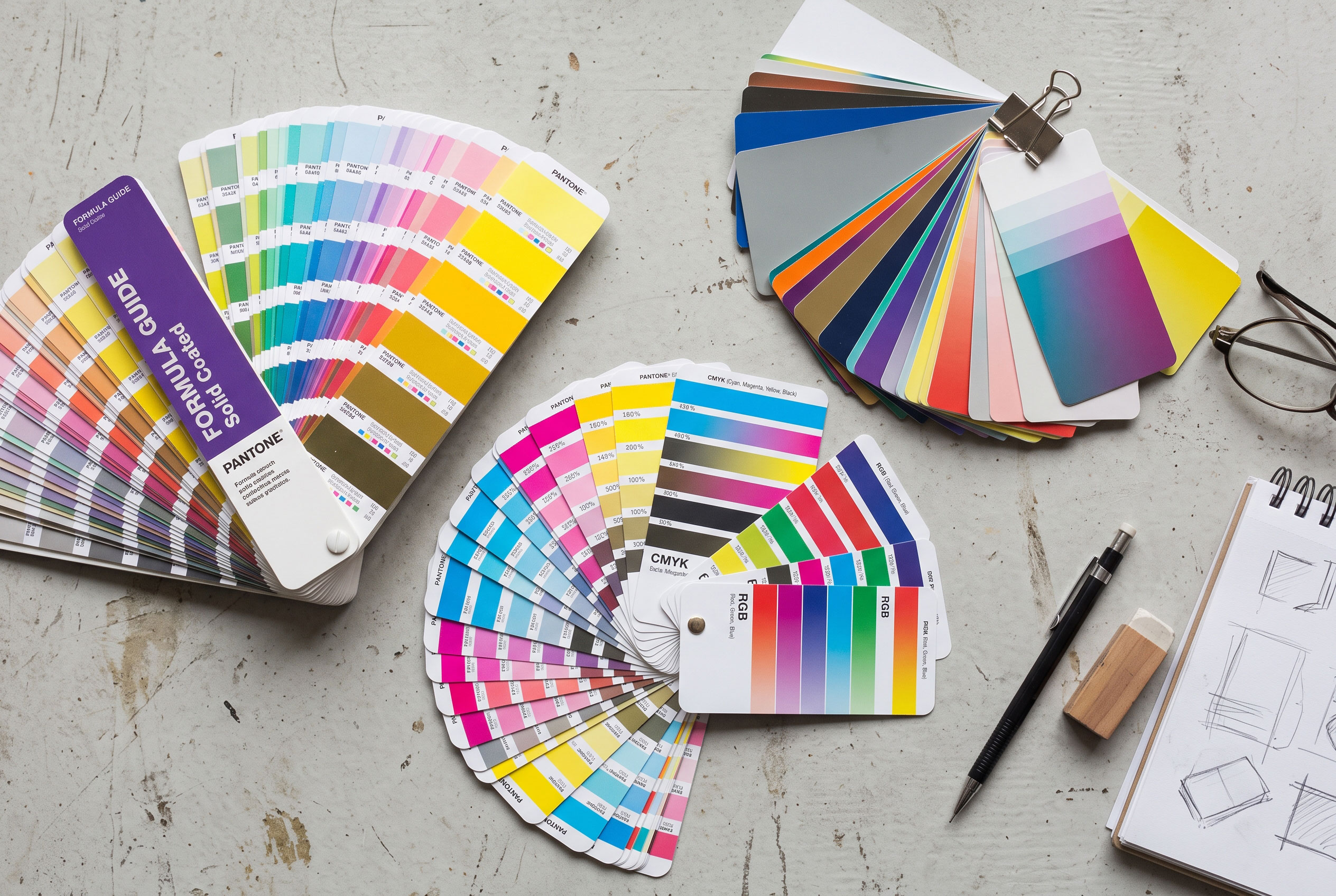 Fanned-out color swatch cards on a flat surface.